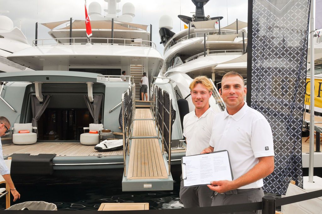 Yachts and crew on the docks at the 2026 Monaco Yacht Show in Port Hercule, Monaco.