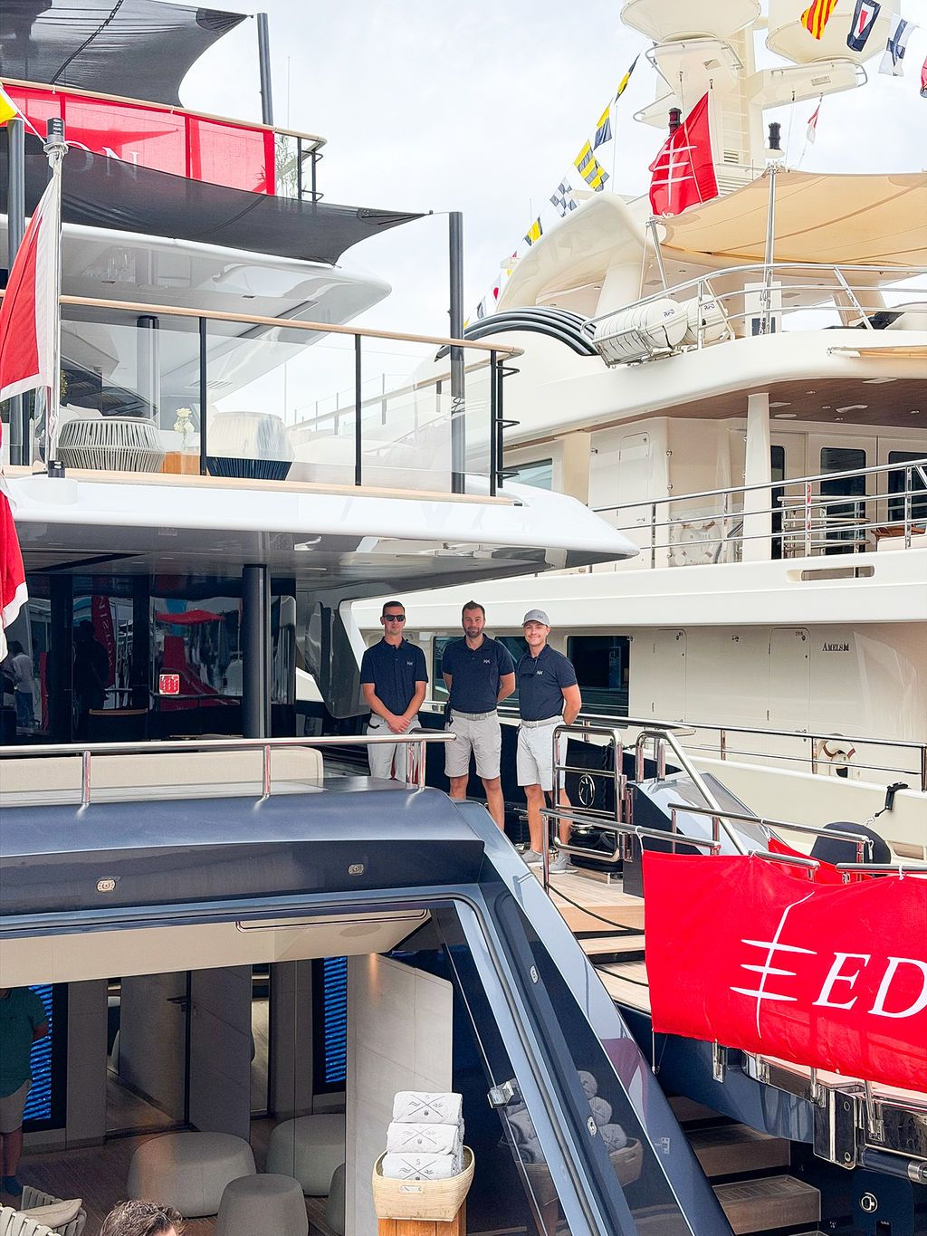 Yachts and crew on the docks at the 2026 Monaco Yacht Show in Port Hercule, Monaco.