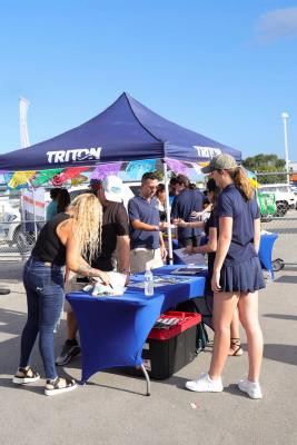 Guests networking at The Triton's Crew, Captains & Connections event at Nautical Ventures Marina.