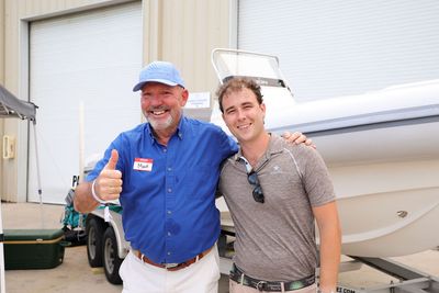 Guests networking at The Triton's Crew, Captains & Connections event at Nautical Ventures Marina.