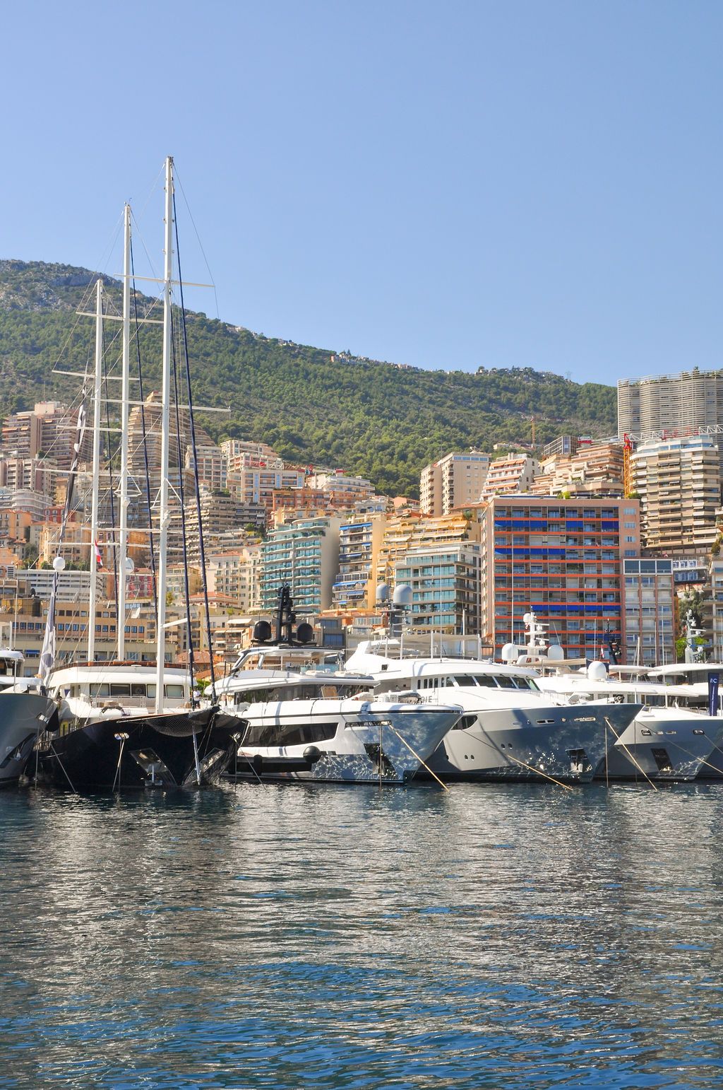 Yachts and crew on the docks at the 2026 Monaco Yacht Show in Port Hercule, Monaco.