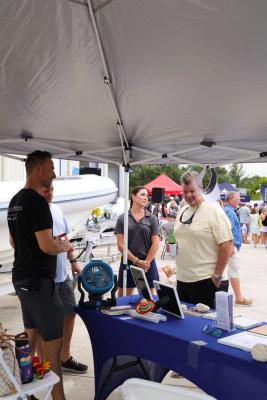 Guests networking at The Triton's Crew, Captains & Connections event at Nautical Ventures Marina.