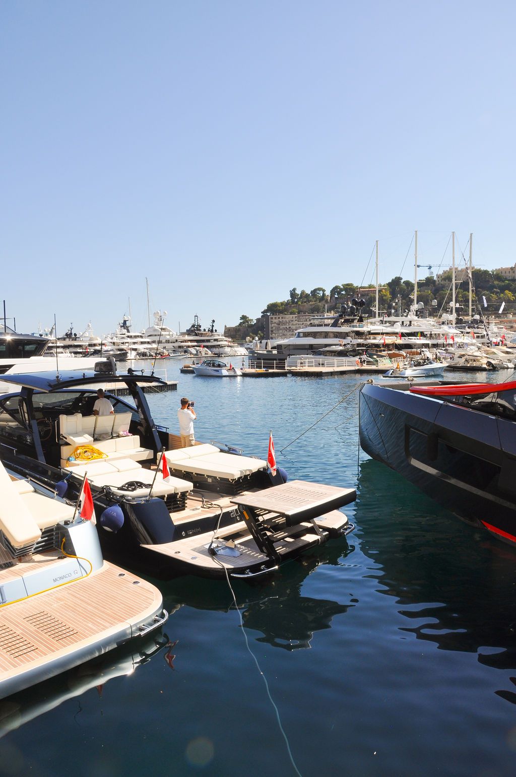 Yachts and crew on the docks at the 2026 Monaco Yacht Show in Port Hercule, Monaco.