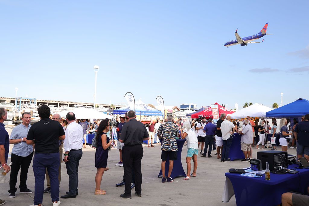 Guests networking at The Triton's Crew, Captains & Connections event at Nautical Ventures Marina.
