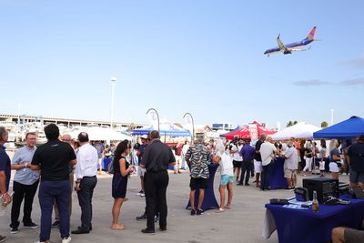 Guests networking at The Triton's Crew, Captains & Connections event at Nautical Ventures Marina.
