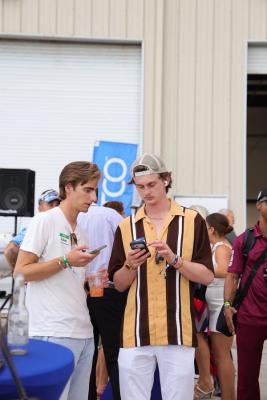 Guests networking at The Triton's Crew, Captains & Connections event at Nautical Ventures Marina.