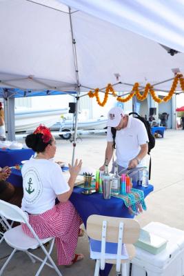 Guests networking at The Triton's Crew, Captains & Connections event at Nautical Ventures Marina.