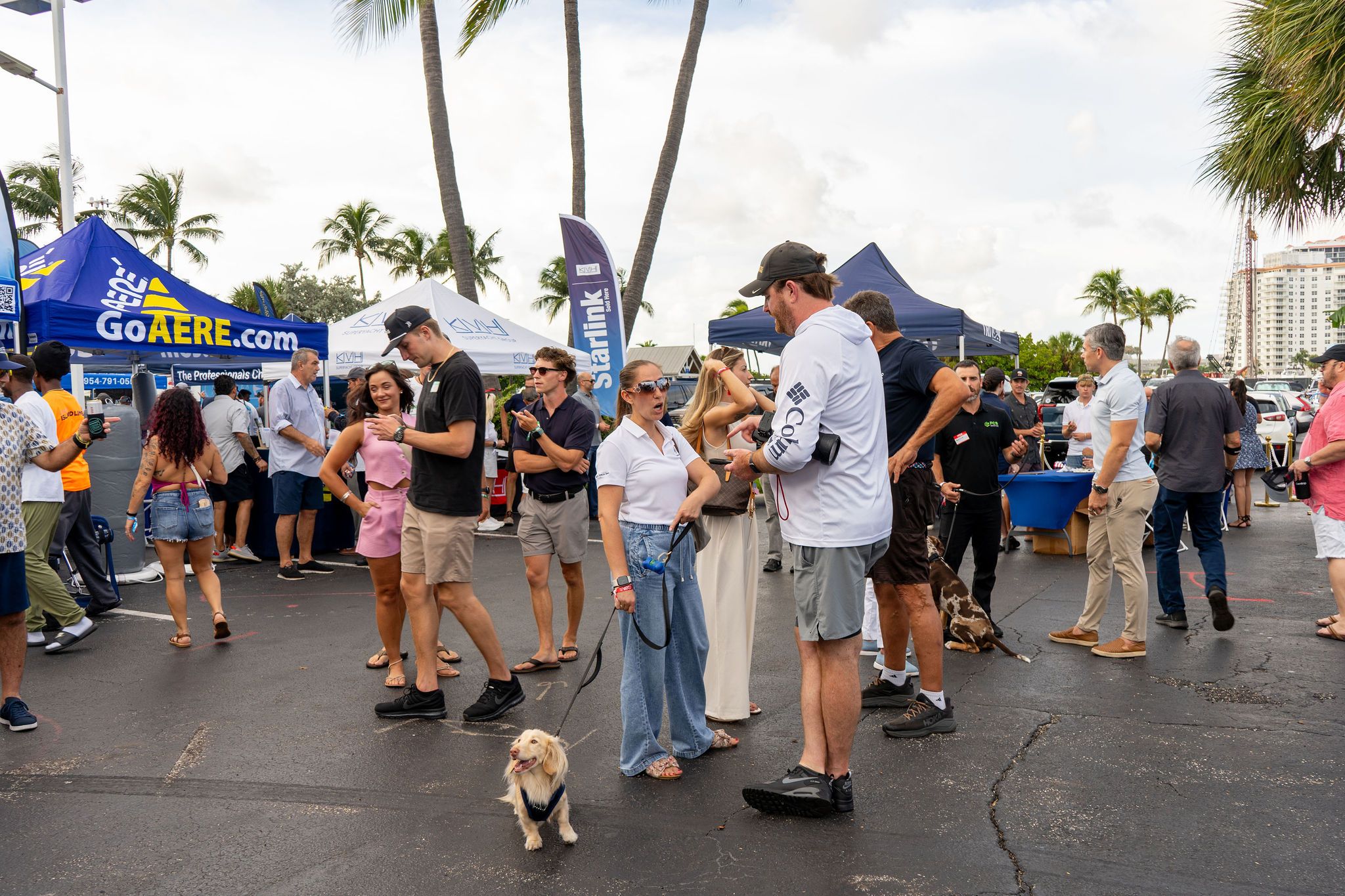 Guests in candid and group photos at The Triton's Fall Triton Expo at Bahia Mar Yachting Center.