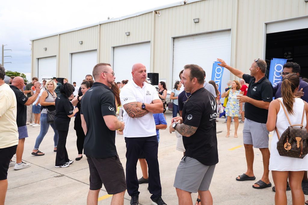Guests networking at The Triton's Crew, Captains & Connections event at Nautical Ventures Marina.