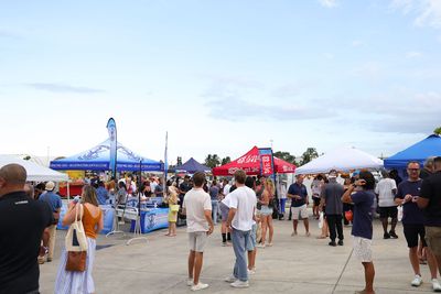 Guests networking at The Triton's Crew, Captains & Connections event at Nautical Ventures Marina.
