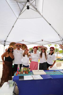 Guests networking at The Triton's Crew, Captains & Connections event at Nautical Ventures Marina.