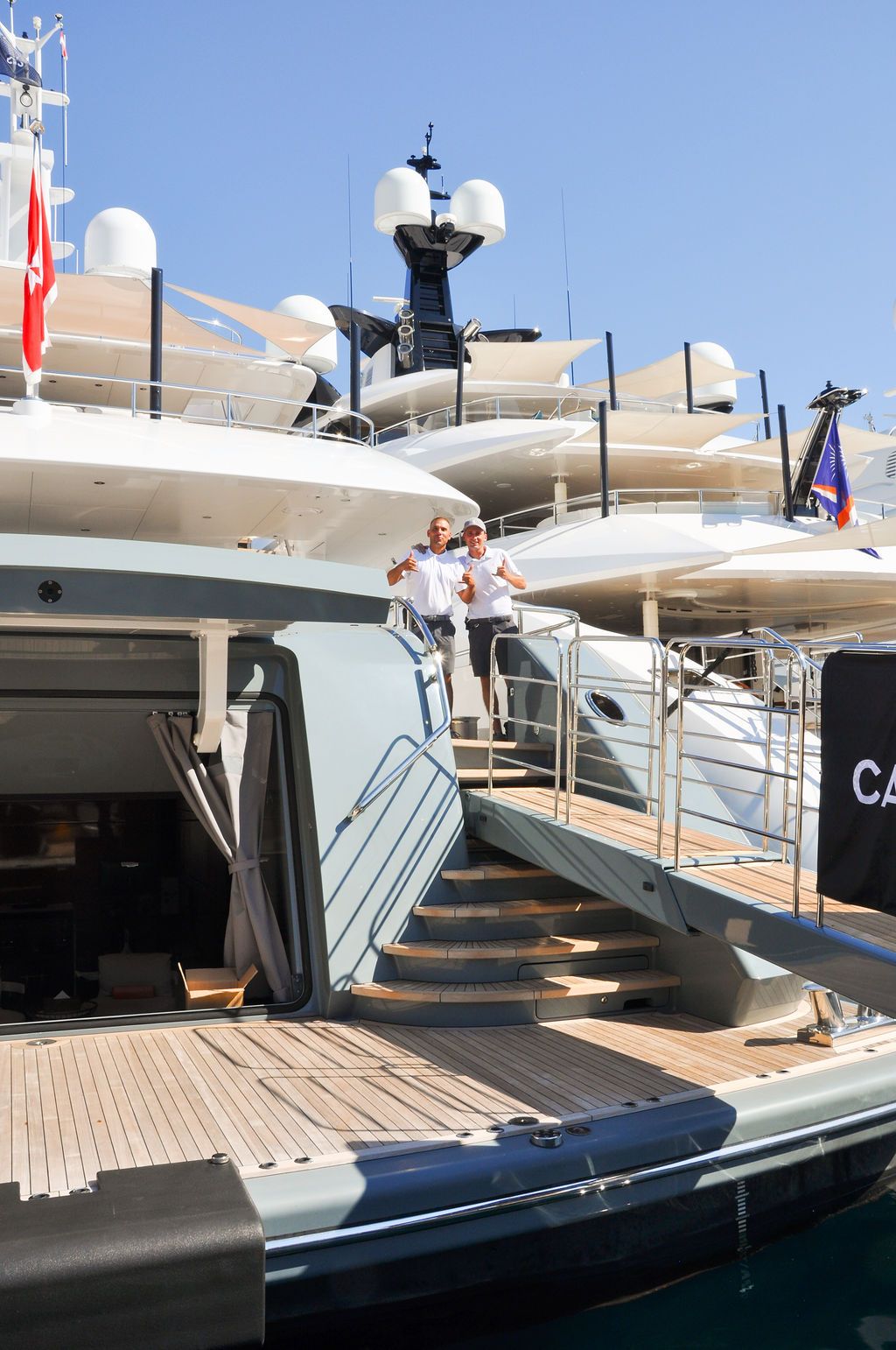 Yachts and crew on the docks at the 2026 Monaco Yacht Show in Port Hercule, Monaco.