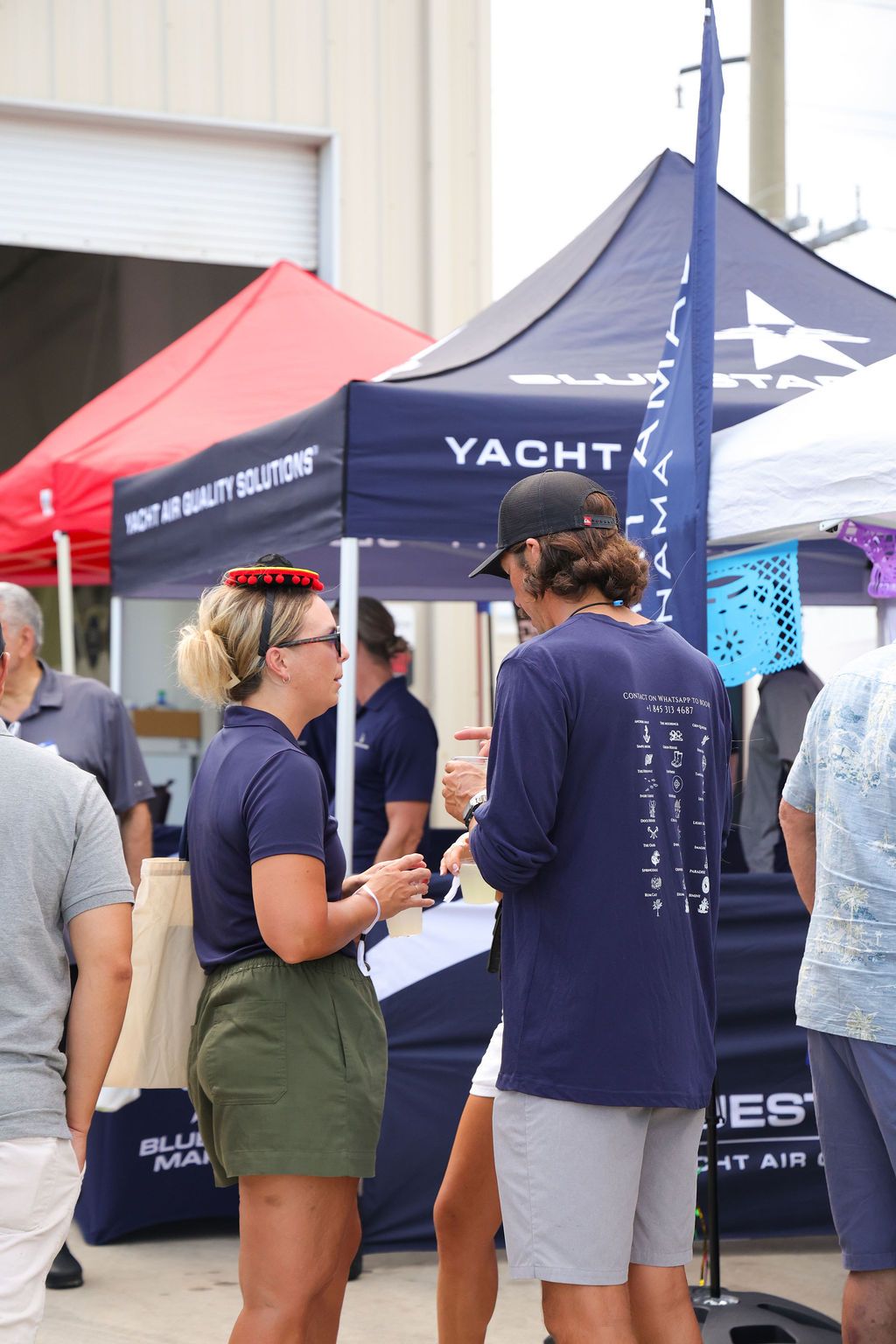 Guests networking at The Triton's Crew, Captains & Connections event at Nautical Ventures Marina.