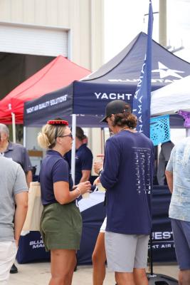 Guests networking at The Triton's Crew, Captains & Connections event at Nautical Ventures Marina.