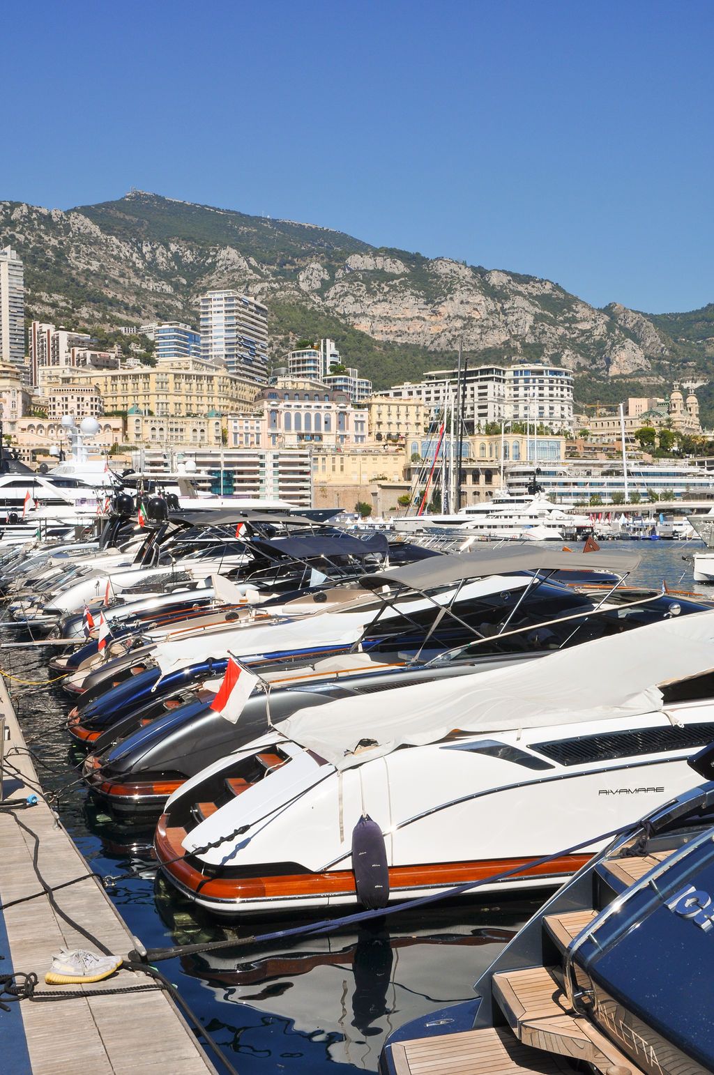 Yachts and crew on the docks at the 2026 Monaco Yacht Show in Port Hercule, Monaco.