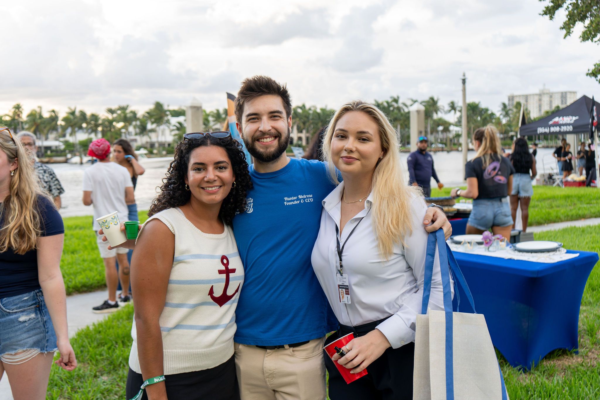Guests in candid and group photos at The Triton's Fall Triton Expo at Bahia Mar Yachting Center.