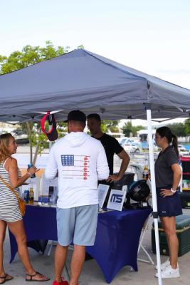 Guests networking at The Triton's Crew, Captains & Connections event at Nautical Ventures Marina.