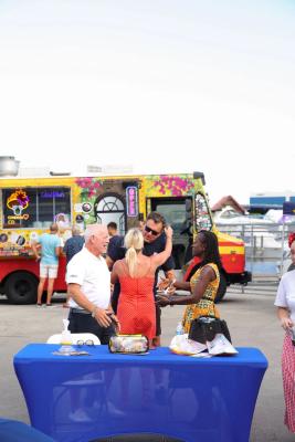Guests networking at The Triton's Crew, Captains & Connections event at Nautical Ventures Marina.