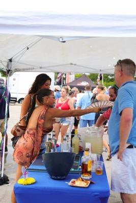 Guests networking at The Triton's Crew, Captains & Connections event at Nautical Ventures Marina.