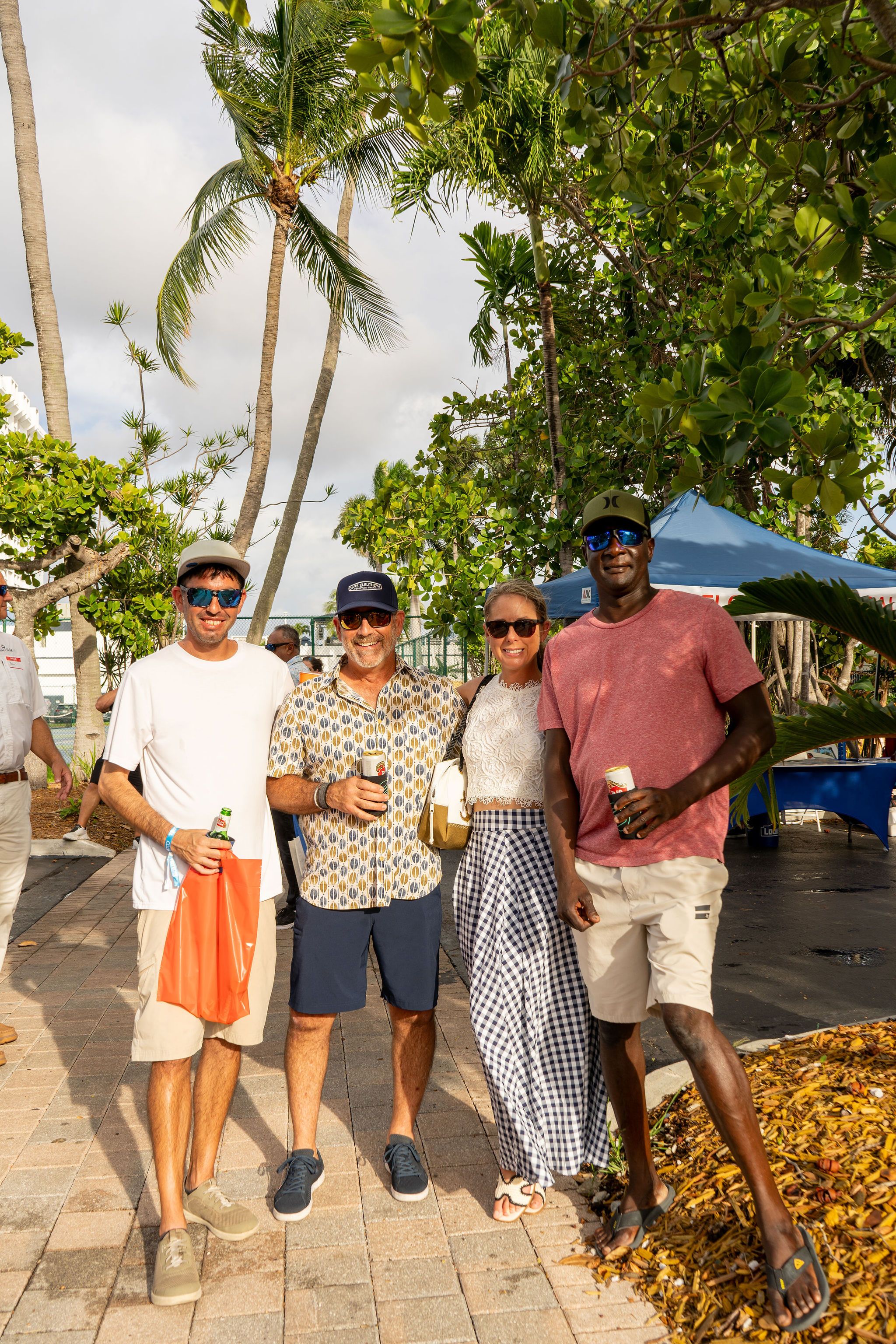 Guests in candid and group photos at The Triton's Fall Triton Expo at Bahia Mar Yachting Center.