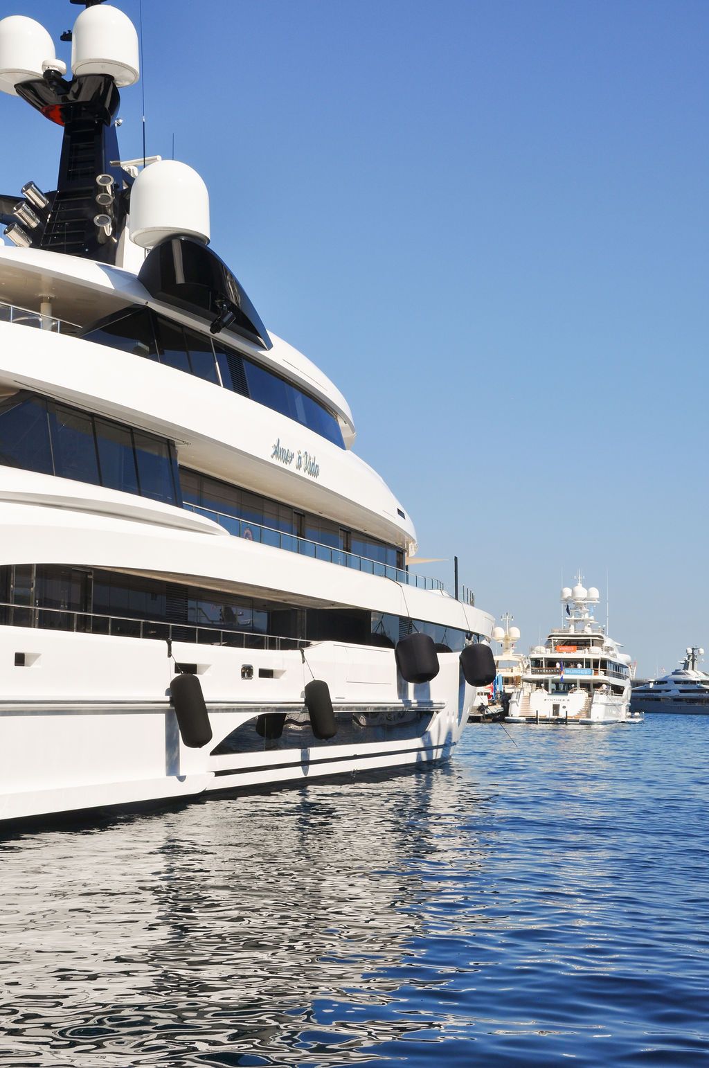 Yachts and crew on the docks at the 2026 Monaco Yacht Show in Port Hercule, Monaco.