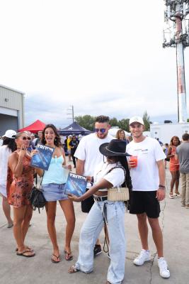 Guests networking at The Triton's Crew, Captains & Connections event at Nautical Ventures Marina.