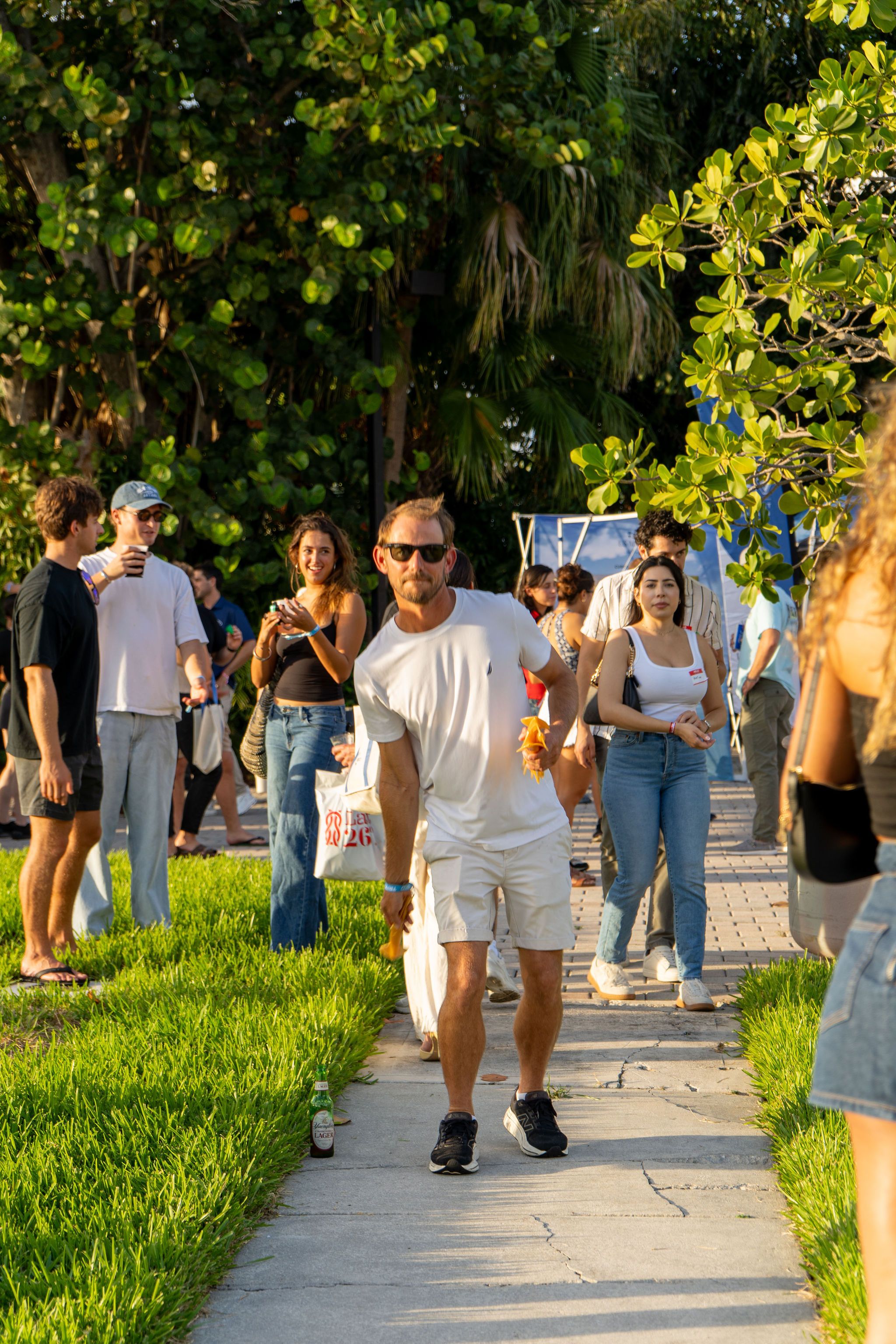 Guests in candid and group photos at The Triton's Fall Triton Expo at Bahia Mar Yachting Center.