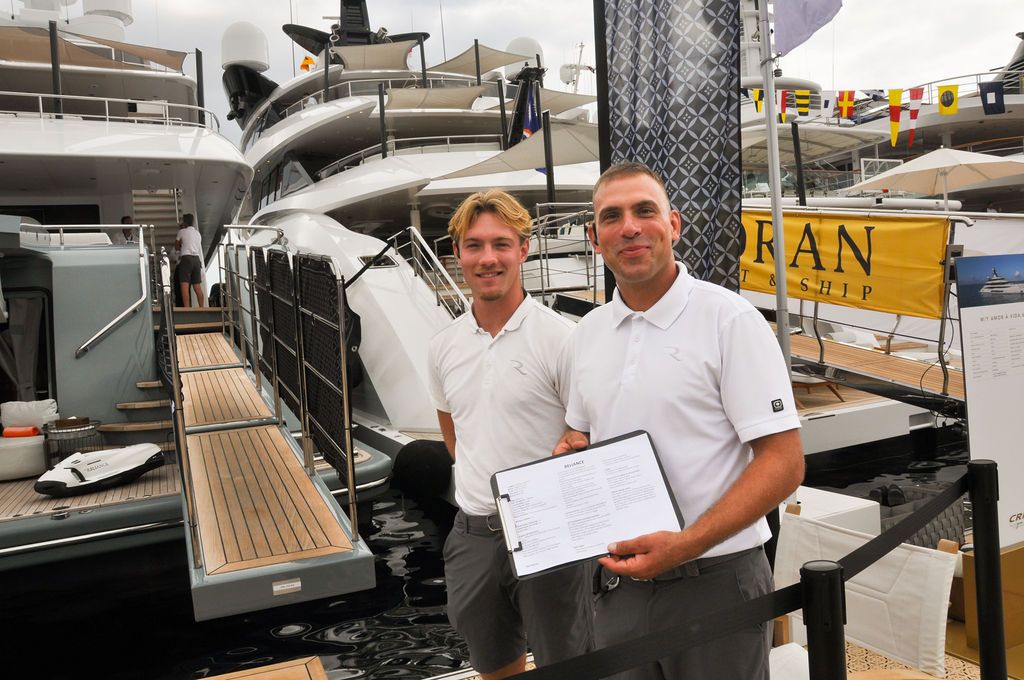 Yachts and crew on the docks at the 2026 Monaco Yacht Show in Port Hercule, Monaco.