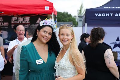 Guests networking at The Triton's Crew, Captains & Connections event at Nautical Ventures Marina.