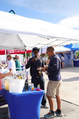 Guests networking at The Triton's Crew, Captains & Connections event at Nautical Ventures Marina.