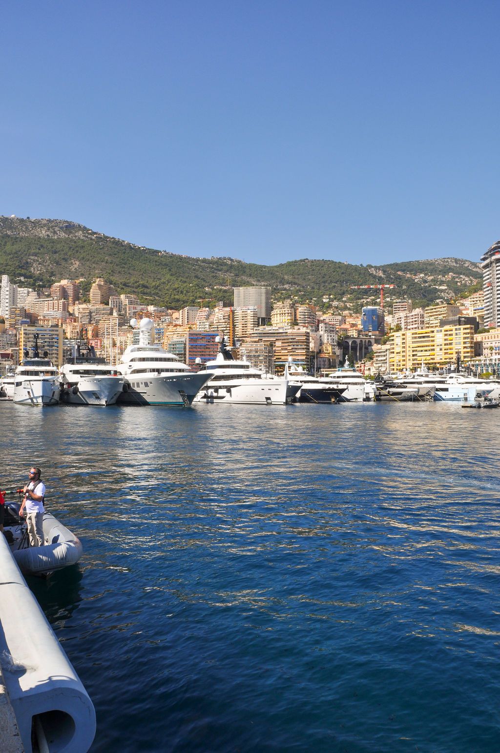 Yachts and crew on the docks at the 2026 Monaco Yacht Show in Port Hercule, Monaco.