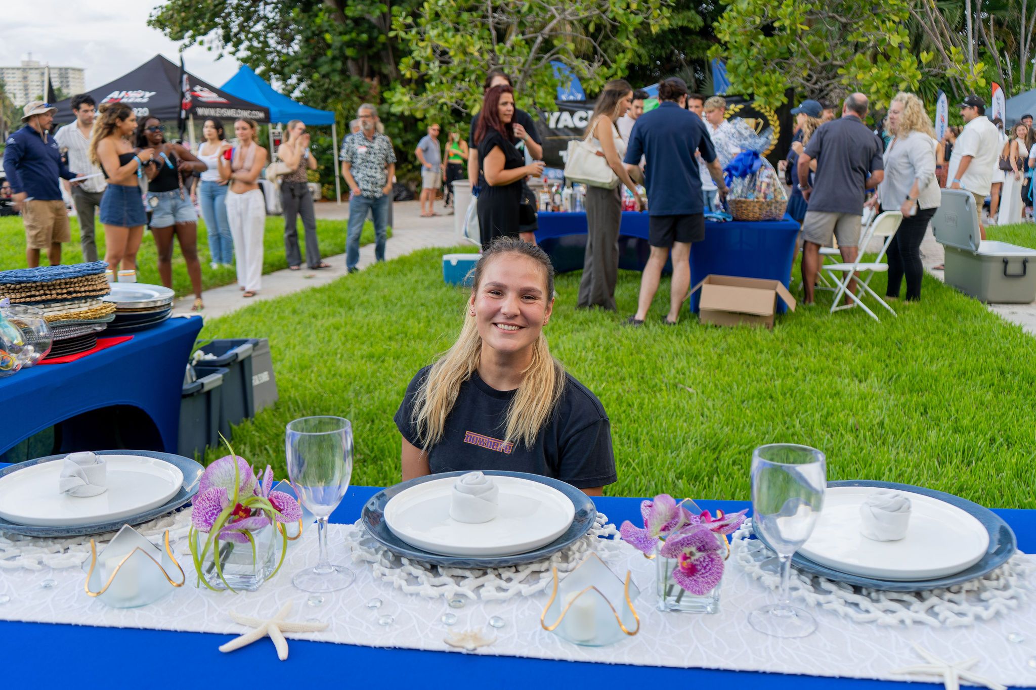 Guests in candid and group photos at The Triton's Fall Triton Expo at Bahia Mar Yachting Center.