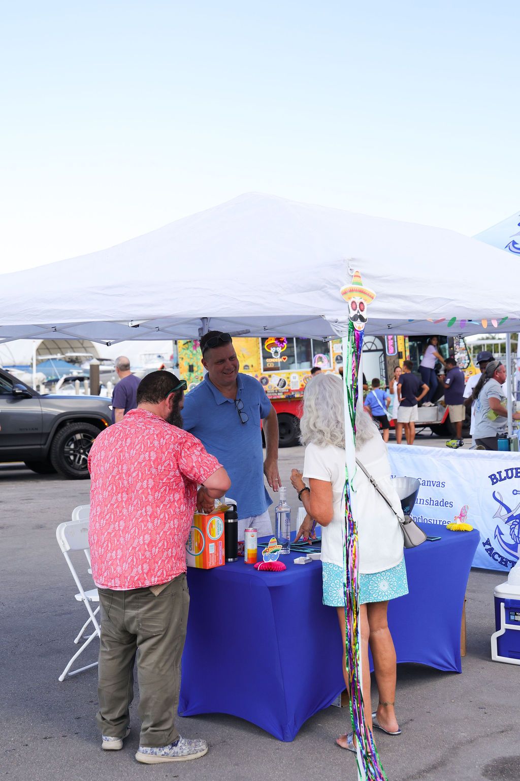 Guests networking at The Triton's Crew, Captains & Connections event at Nautical Ventures Marina.