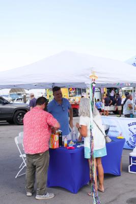 Guests networking at The Triton's Crew, Captains & Connections event at Nautical Ventures Marina.