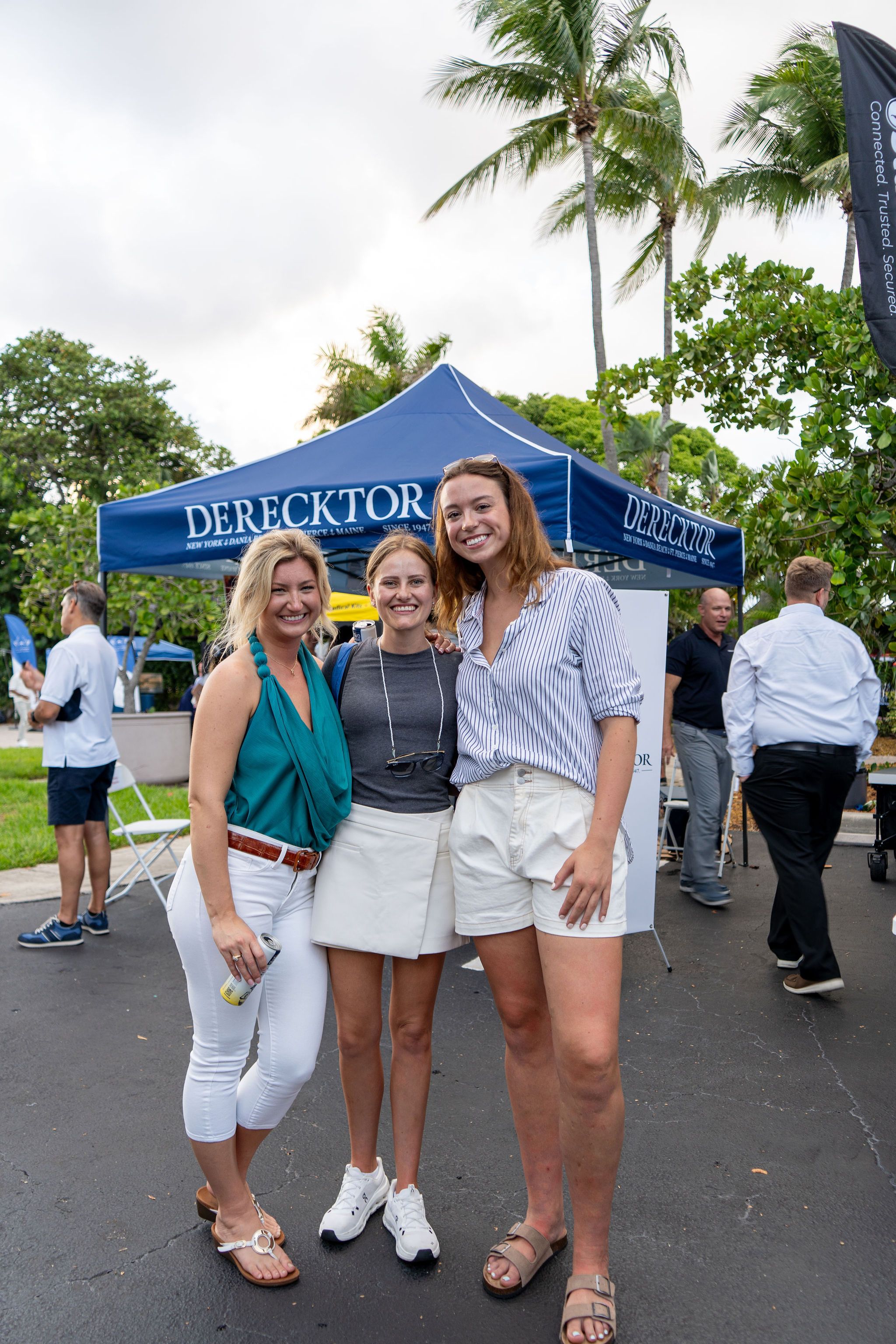 Guests in candid and group photos at The Triton's Fall Triton Expo at Bahia Mar Yachting Center.