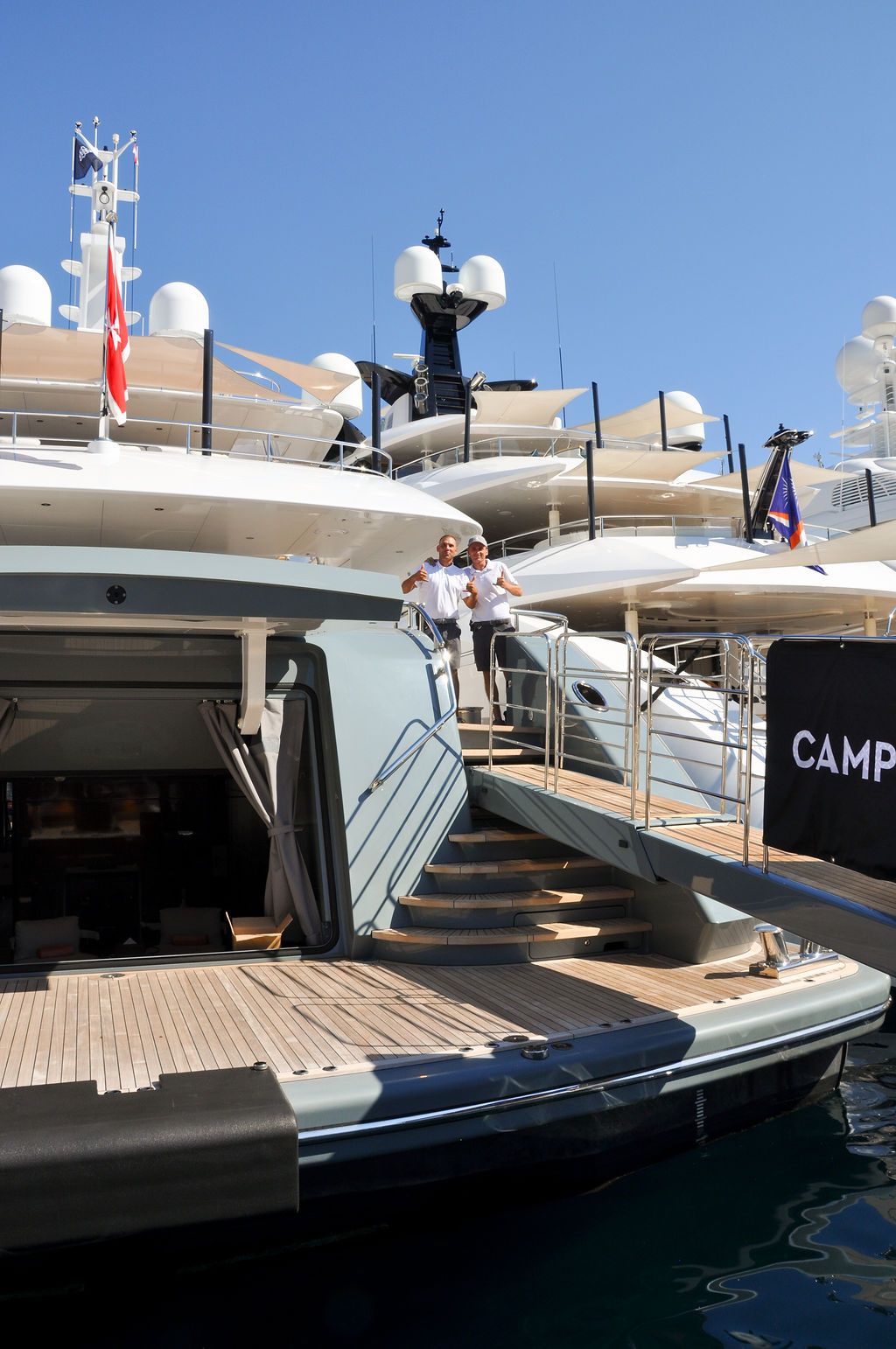 Yachts and crew on the docks at the 2026 Monaco Yacht Show in Port Hercule, Monaco.