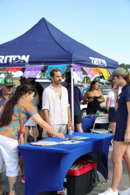 Guests networking at The Triton's Crew, Captains & Connections event at Nautical Ventures Marina.