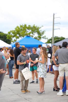 Guests networking at The Triton's Crew, Captains & Connections event at Nautical Ventures Marina.