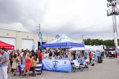 Guests networking at The Triton's Crew, Captains & Connections event at Nautical Ventures Marina.
