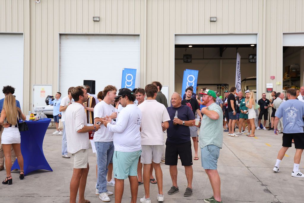 Guests networking at The Triton's Crew, Captains & Connections event at Nautical Ventures Marina.