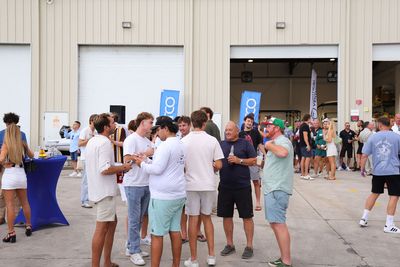 Guests networking at The Triton's Crew, Captains & Connections event at Nautical Ventures Marina.