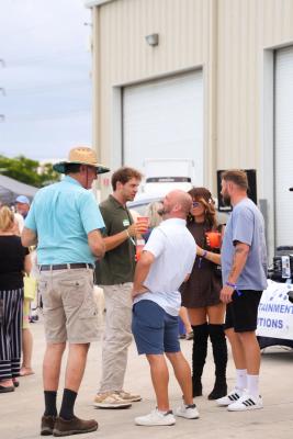 Guests networking at The Triton's Crew, Captains & Connections event at Nautical Ventures Marina.