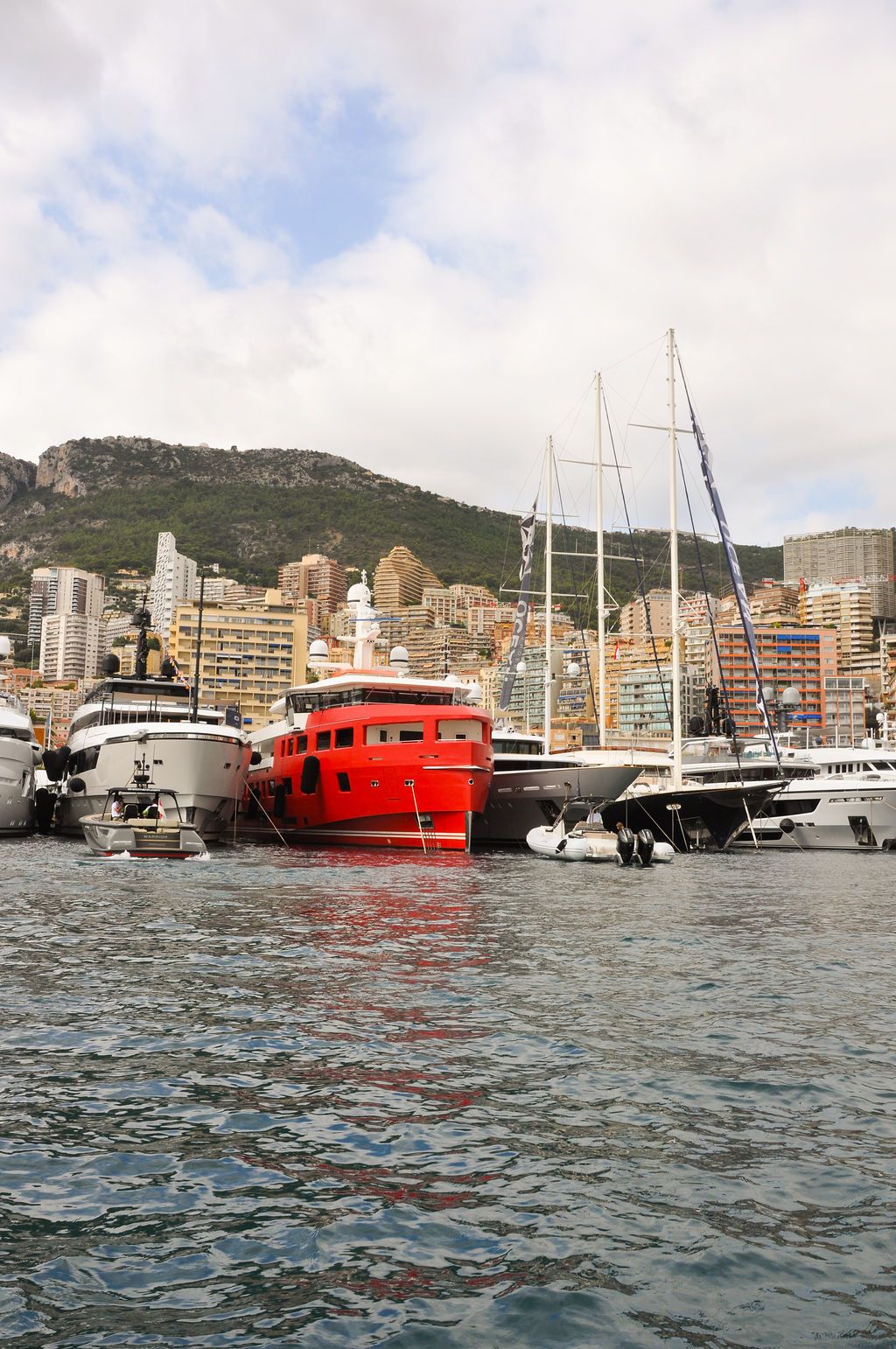 Yachts and crew on the docks at the 2026 Monaco Yacht Show in Port Hercule, Monaco.