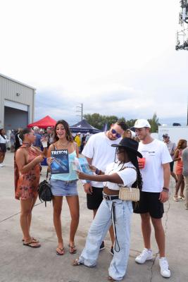 Guests networking at The Triton's Crew, Captains & Connections event at Nautical Ventures Marina.