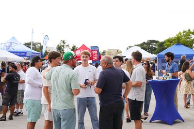 Guests networking at The Triton's Crew, Captains & Connections event at Nautical Ventures Marina.