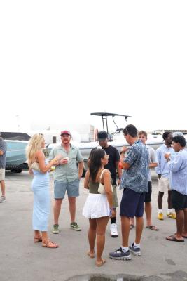 Guests networking at The Triton's Crew, Captains & Connections event at Nautical Ventures Marina.