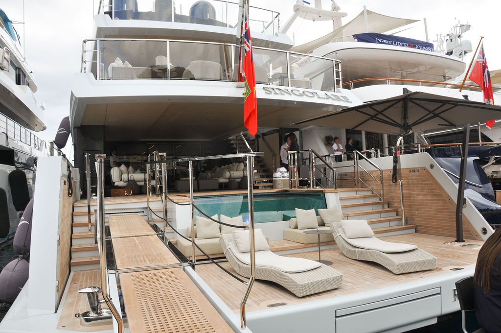 Yachts and crew on the docks at the 2026 Monaco Yacht Show in Port Hercule, Monaco.
