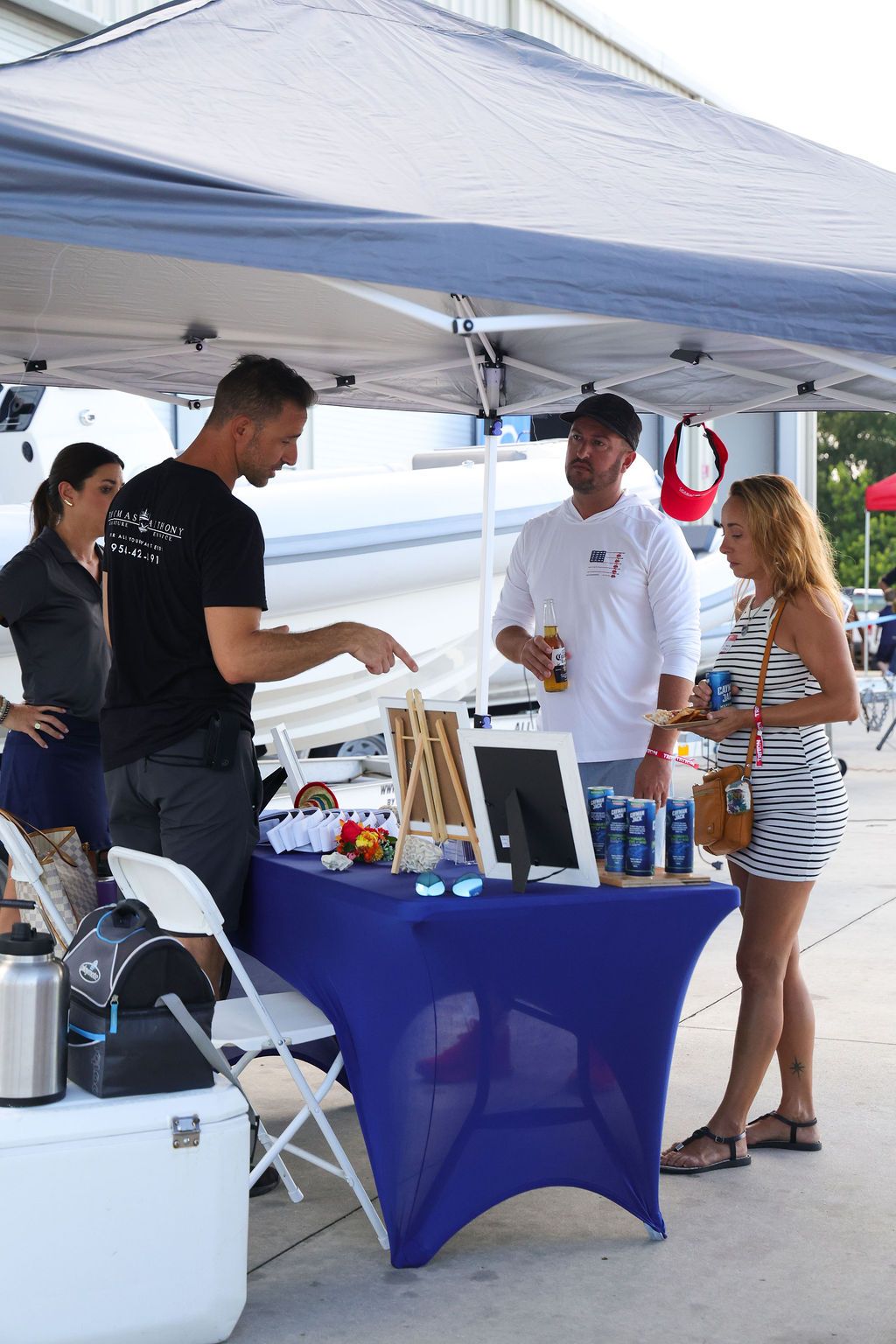 Guests networking at The Triton's Crew, Captains & Connections event at Nautical Ventures Marina.