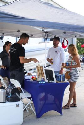 Guests networking at The Triton's Crew, Captains & Connections event at Nautical Ventures Marina.
