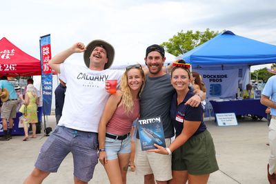Guests networking at The Triton's Crew, Captains & Connections event at Nautical Ventures Marina.